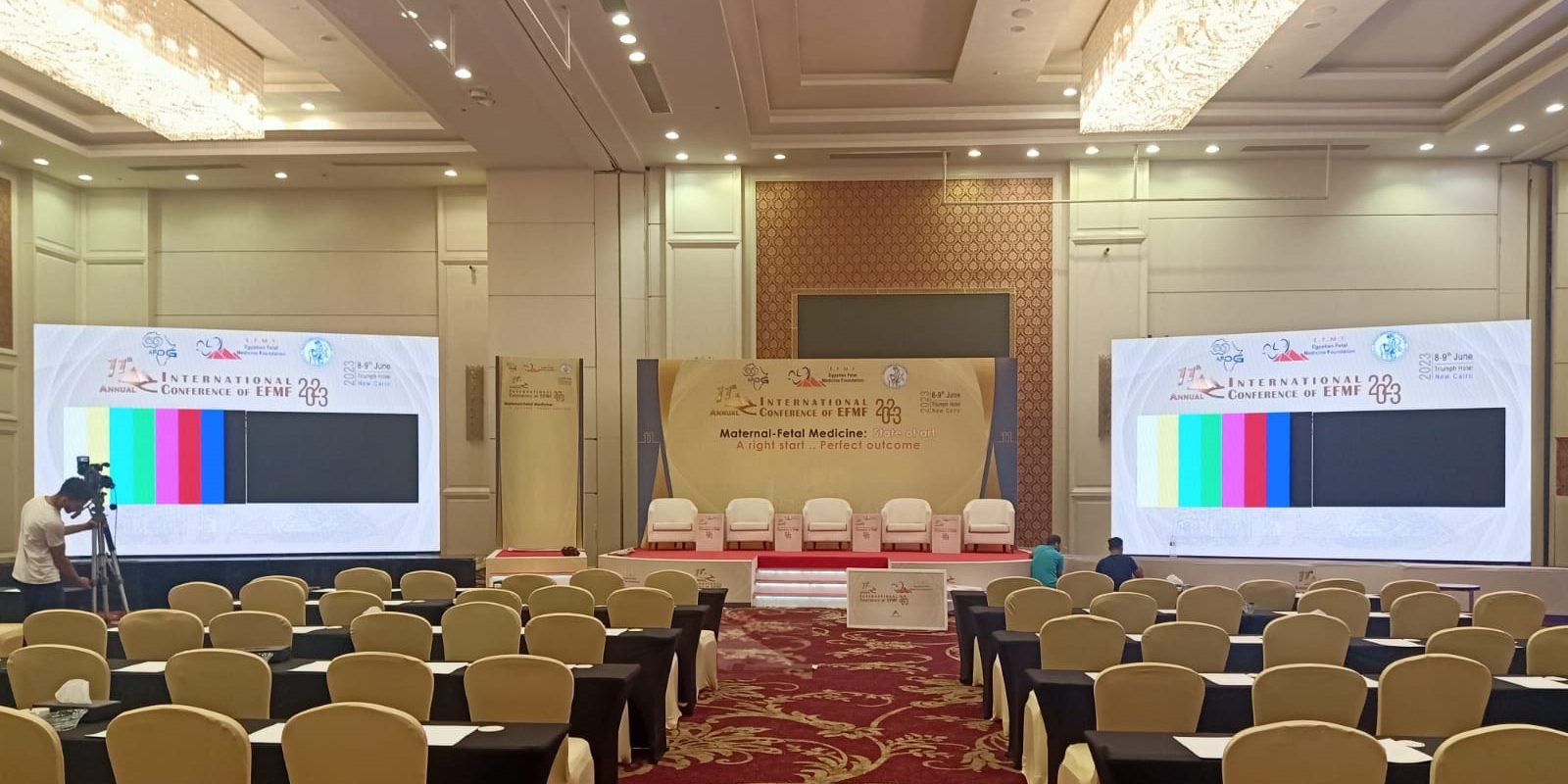 Conference hall set with dual LED screens and delegate seating by Top-Tech